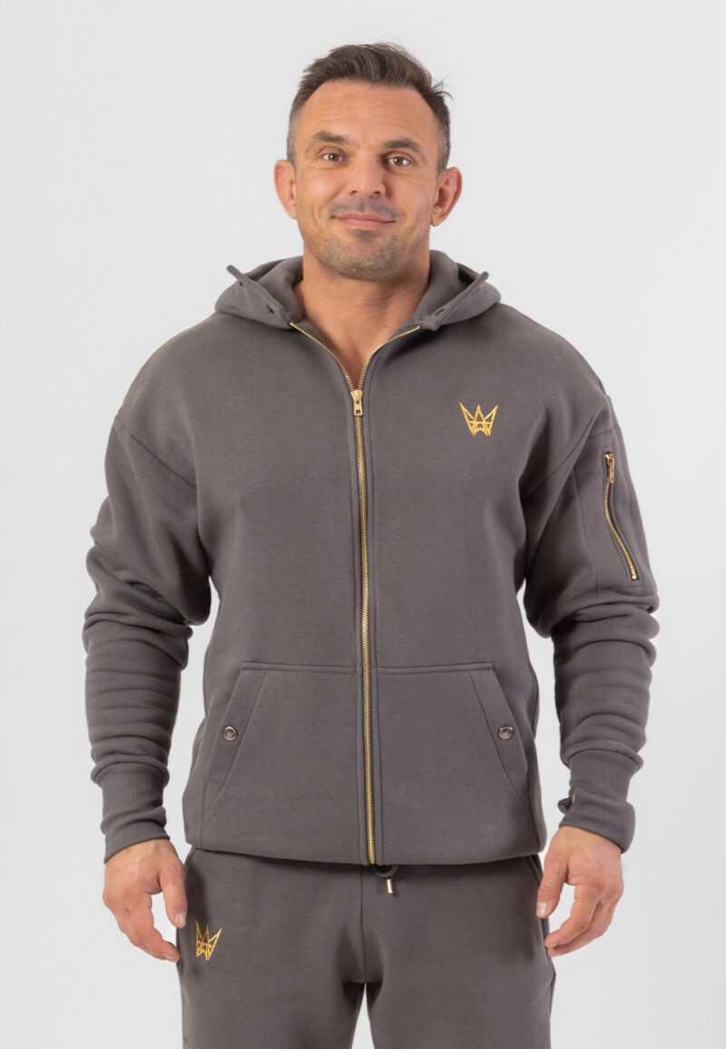 Bluza Grizzly o kroju oversize w kolorze szarym zapinana na zamek z haftowaną koroną w kolorze złotym.