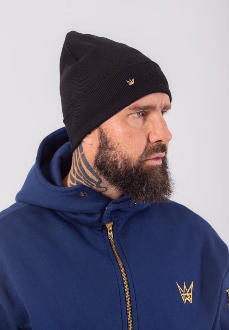 Podwijana czapka zimowa wykonana z bawełny w kolorze czarnym z koroną ze złota 585.