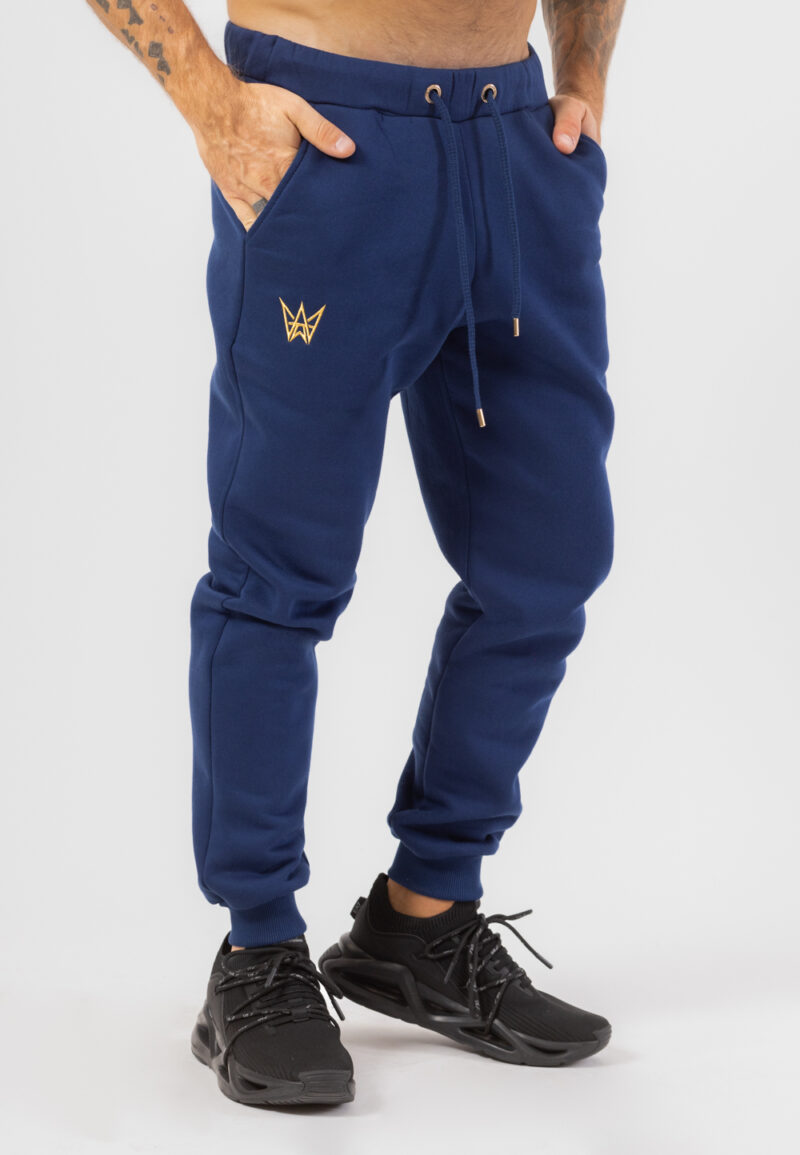 Dresowe spodnie bawełniane w kolorze granatowym ze złotą haftowaną koroną.